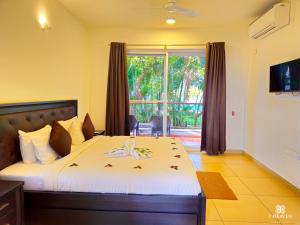 TV a/nebo společenská místnost v ubytování 7 Heaven Villas & Resorts