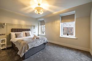 a bedroom with a large bed and a window at Sandbed in Hawick