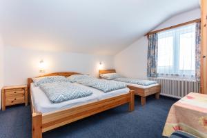Postel nebo postele na pokoji v ubytování Ferienhaus Alpenrose