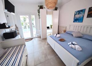 Postel nebo postele na pokoji v ubytování Casa del mare