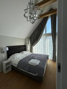 Postel nebo postele na pokoji v ubytování Nadmorskie Ostrowo