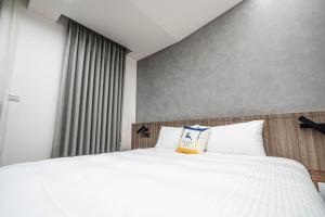 Letto o letti in una camera di 眺浪島民宿