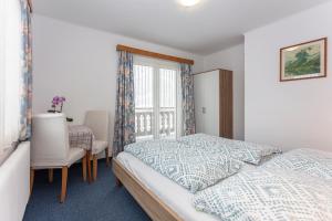 Postel nebo postele na pokoji v ubytování Ferienhaus Alpenrose