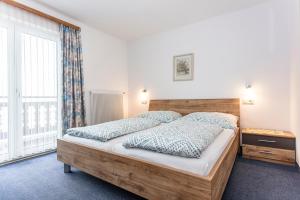 Postel nebo postele na pokoji v ubytování Ferienhaus Alpenrose