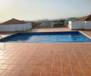 a swimming pool on top of a house at ASDK Home 908-14 in Dubai