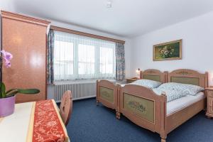 Postel nebo postele na pokoji v ubytování Ferienhaus Alpenrose
