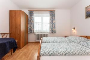 Postel nebo postele na pokoji v ubytování Ferienhaus Alpenrose