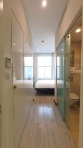 a room with a bed and a glass door at 39 Studios in London