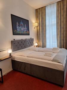 Postel nebo postele na pokoji v ubytování Hotel Amelie Berlin