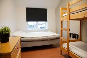 Llit o llits en una habitació de Lava Hostel