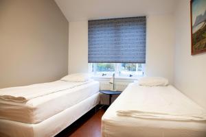 Llit o llits en una habitació de Lava Hostel