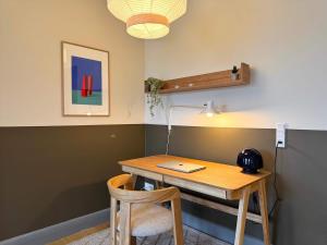 a room with a desk with a laptop on it at Copenhagen Collection King s Garden Studio in Copenhagen