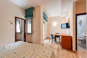Postel nebo postele na pokoji v ubytování Hotel Barsotti