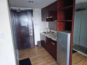 A kitchen or kitchenette at Kota Kinabalu City Ensuite at SCSP Ming Garden