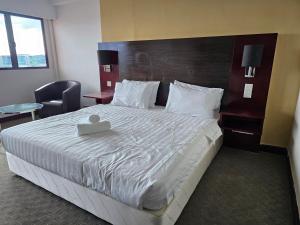 A bed or beds in a room at Kota Kinabalu City Ensuite at SCSP Ming Garden