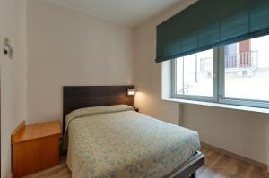 Postel nebo postele na pokoji v ubytování Hotel Barsotti
