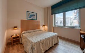 Postel nebo postele na pokoji v ubytování Hotel Barsotti