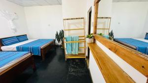 A bed or beds in a room at Sigiriya Paradise Treehouse