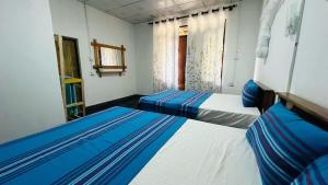 A bed or beds in a room at Sigiriya Paradise Treehouse