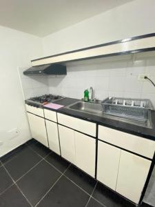 Kuchyň nebo kuchyňský kout v ubytování CAS V&B Apartamentos