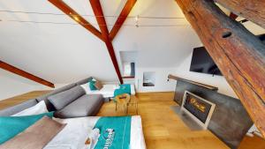 TV a/nebo společenská místnost v ubytování Zentral Altstadt Chur - Bahnhofsnah - Ferienwohnung - Bernina Express - Solution-Grischun