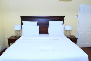 Postel nebo postele na pokoji v ubytování Suprime Hotels and Conference