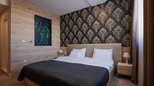 Letto o letti in una camera di IG Hotel