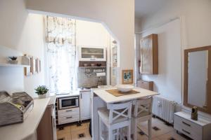 a kitchen with a island in the middle of a room at Cobalt Haven Apartment in Budapest