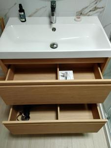 a bathroom vanity with a white sink in it at Casa 35 Barrio El Charco Puerto del Rosario in Puerto del Rosario +71 photos