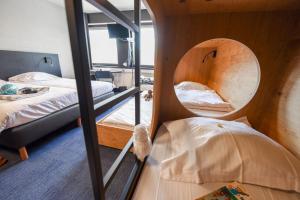 Voodi või voodid majutusasutuse Vakantiedomein Hoge Duin toas