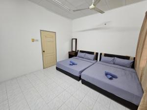 Postel nebo postele na pokoji v ubytování Sunrise Hostel