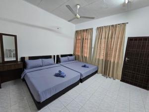 Postel nebo postele na pokoji v ubytování Sunrise Hostel