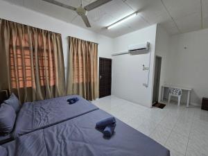 Postel nebo postele na pokoji v ubytování Sunrise Hostel