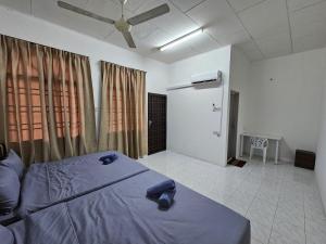 Postel nebo postele na pokoji v ubytování Sunrise Hostel