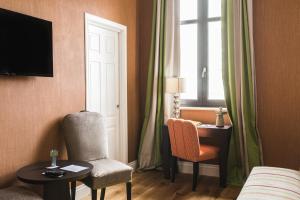 TV a/nebo společenská místnost v ubytování Vmaison Hotel Messina