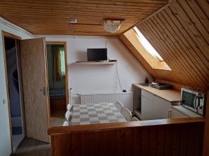 Kuchyň nebo kuchyňský kout v ubytování Aranyharmat Apartman Eu