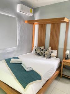 Postel nebo postele na pokoji v ubytování Apartamentos Melya cerca de la Playa Caleta
