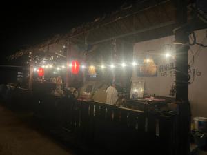 a train station at night with lights on it at Pa Mali homestay in Ko Lipe