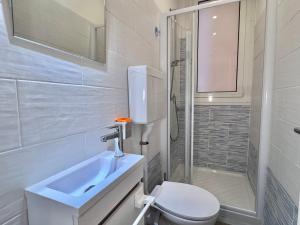 a bathroom with a toilet and a sink and a shower at La Casa Di Giorgio in Sanremo