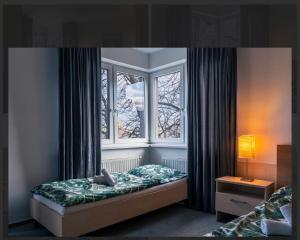 Postel nebo postele na pokoji v ubytování Pension Edison + 4 fotografie