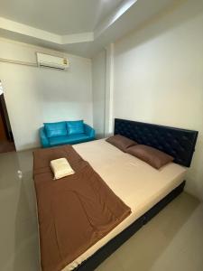 Postel nebo postele na pokoji v ubytování Nuttida resort ณัฐธิดา รีสอร์ท