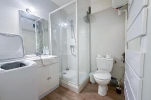 a white bathroom with a toilet and a shower at #AR Le Saint François Hypercentre in Grenoble