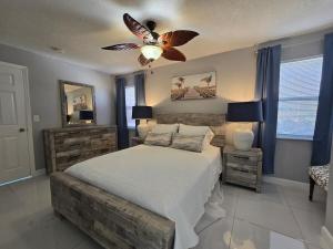 a bedroom with a bed and a ceiling fan at Green Keys Ranch in Homestead