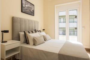 Ένα ή περισσότερα κρεβάτια σε δωμάτιο στο City Rooms Guest House by HD