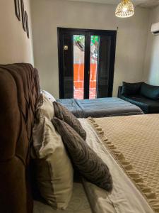 Кровать или кровати в номере Hotel Herrera