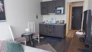 a kitchen with a sink and a counter top at Laine Apartment in Pärnu
