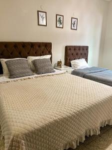 Кровать или кровати в номере Hotel Herrera