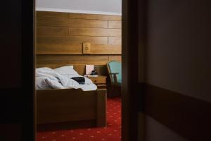 Posteľ alebo postele v izbe v ubytovaní Hotel Martini Kaprun - including summercard & breakfast