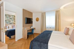 Postel nebo postele na pokoji v ubytování Atrium Hotel Amadeus