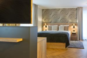 Postel nebo postele na pokoji v ubytování Atrium Hotel Amadeus